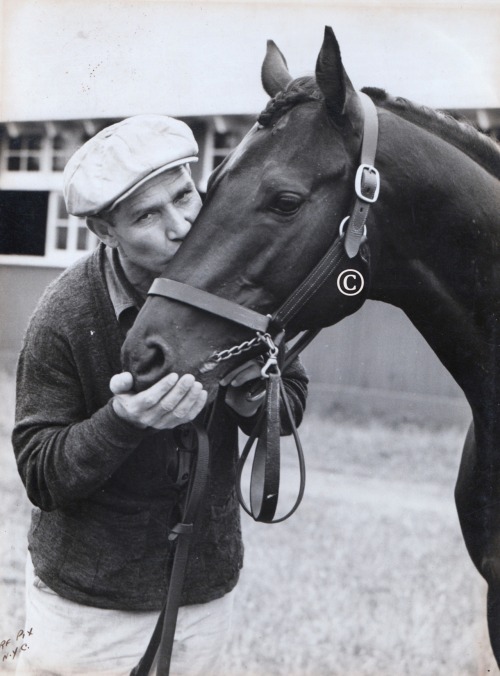 1937 winner War Admiral gets some love from his groom. 