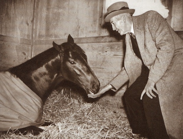 Trainer George Conway visiting his champion War Admiral on the night before the Admiral’s legendary match race with Seabiscuit, Oct. 31, 1938.